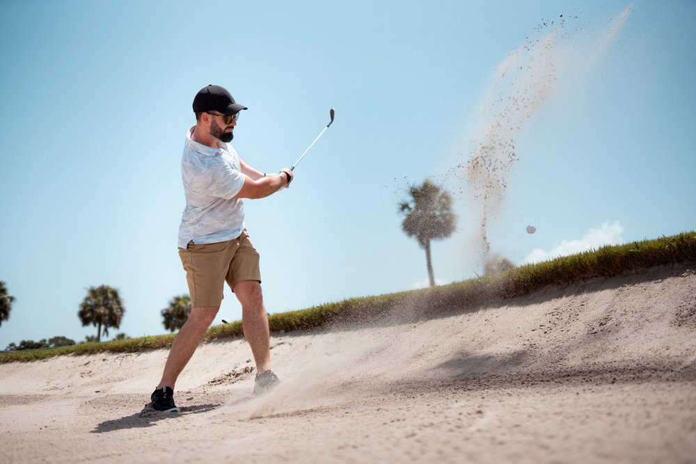 Founders Fairway member swinging a golf club